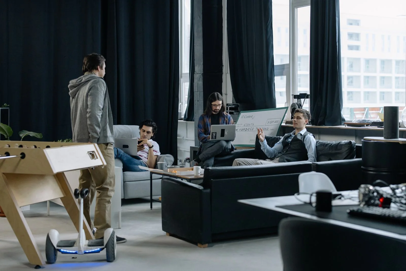 Stock photograph of people collaborating in a creative workspace; not our team.